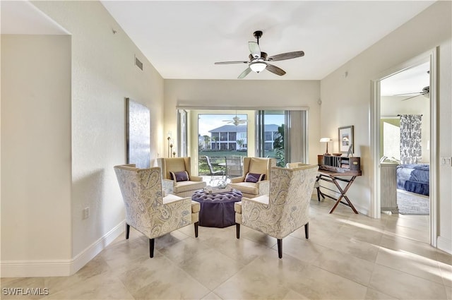 living area featuring ceiling fan