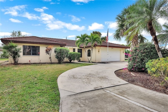 single story home with a garage and a front lawn