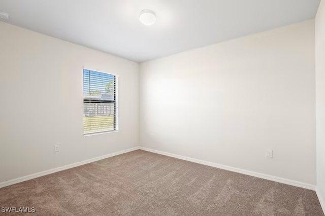 empty room with carpet flooring