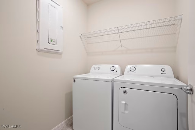 laundry area featuring separate washer and dryer and electric panel