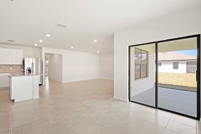 interior space featuring sink and light tile patterned floors