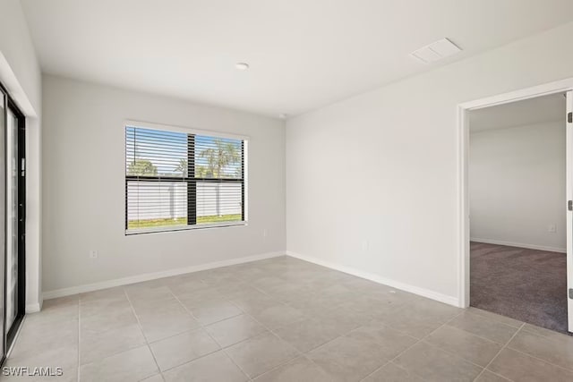 unfurnished bedroom with a closet and light tile patterned flooring