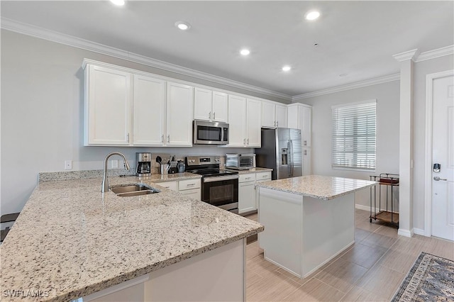 43010 Greenway Blvd Unit 244, Punta Gorda, FL 33982 - kitchen with stainless steel appliances, a sink, crown molding, white cabinets, and light stone countertops
