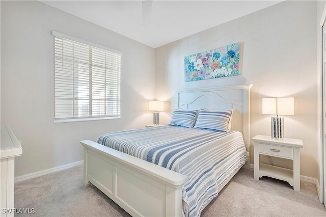 bedroom with light colored carpet