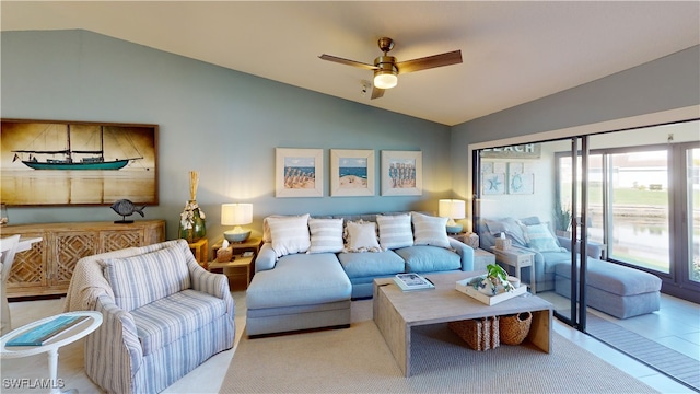 living room with lofted ceiling, light tile patterned floors, and ceiling fan