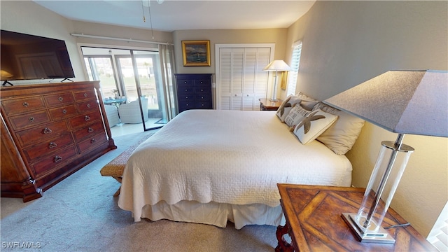 bedroom featuring light colored carpet and access to outside