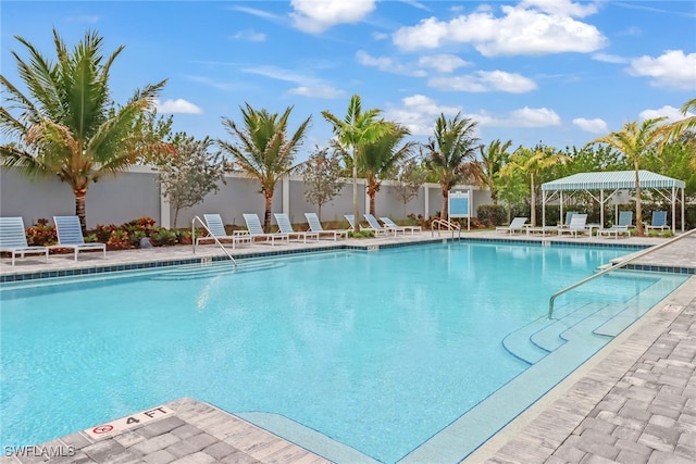 view of swimming pool featuring a patio area