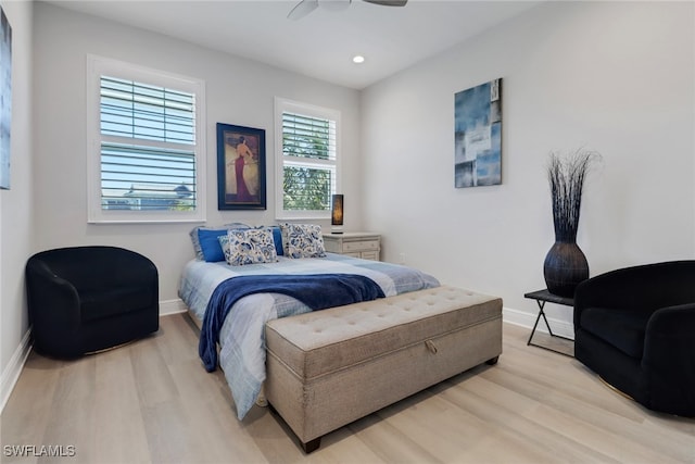 bedroom featuring ceiling fan and light hardwood / wood-style flooring