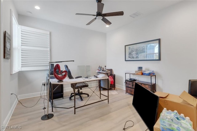 office with ceiling fan and light wood-type flooring