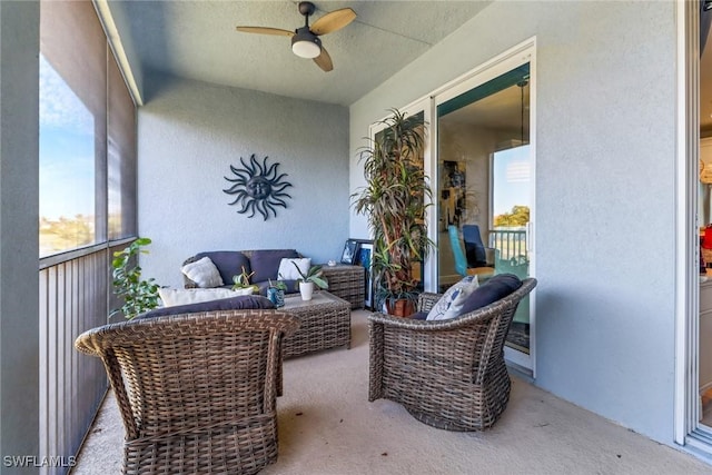 sunroom with a wealth of natural light and ceiling fan