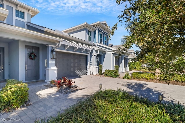 view of front of property with a garage