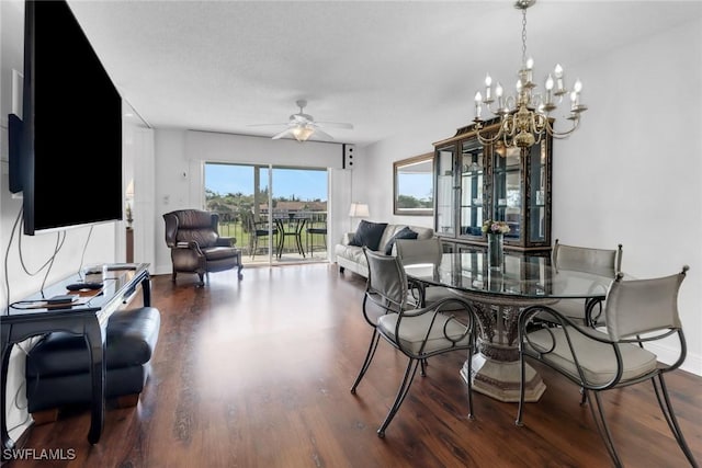 dining room with wood finished floors and ceiling fan with notable chandelier