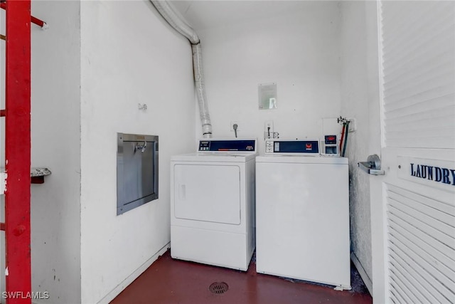 shared laundry area featuring independent washer and dryer