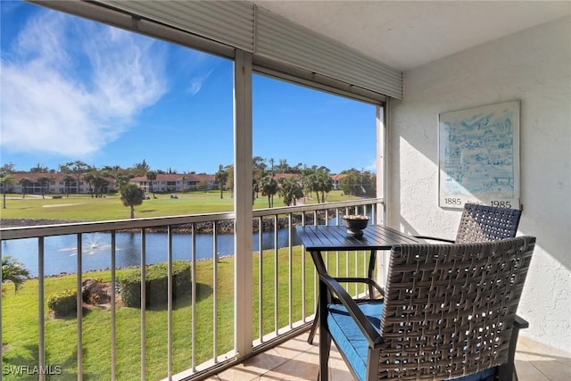 balcony featuring a water view