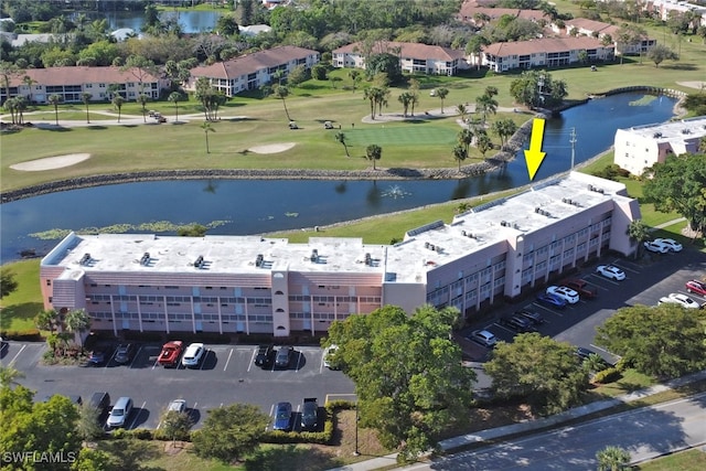 aerial view featuring a water view and golf course view