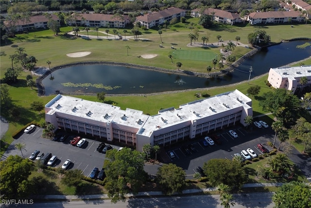 aerial view with view of golf course and a water view