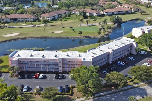 bird's eye view with a water view and golf course view