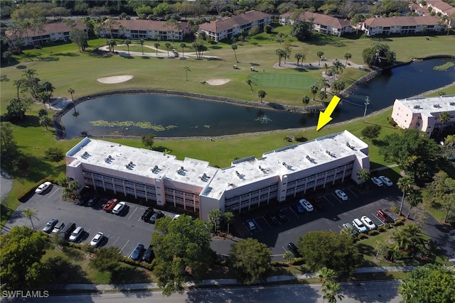 aerial view with view of golf course and a water view