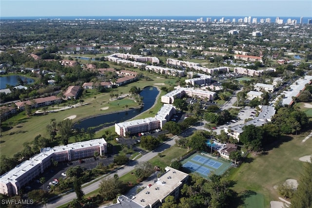 birds eye view of property featuring a water view and golf course view