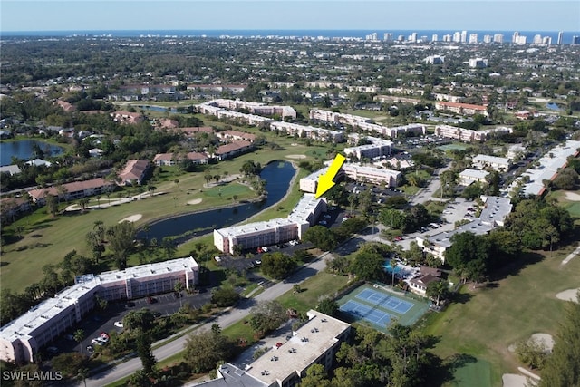 birds eye view of property with a water view