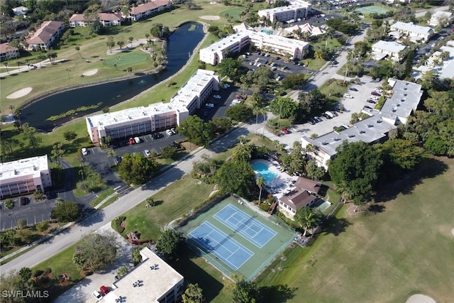 aerial view featuring golf course view and a water view