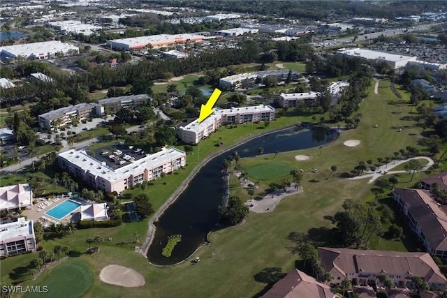 bird's eye view with a water view and view of golf course