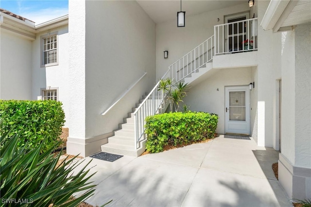 property entrance with a patio area