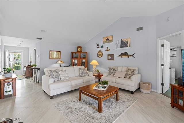 living room featuring vaulted ceiling