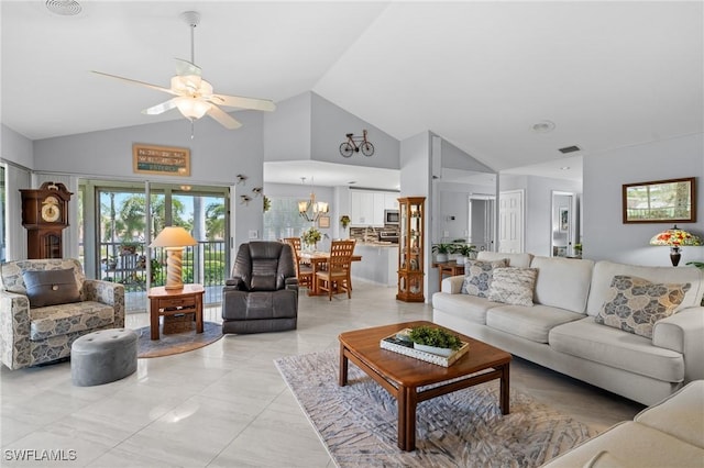 tiled living room featuring high vaulted ceiling and ceiling fan with notable chandelier