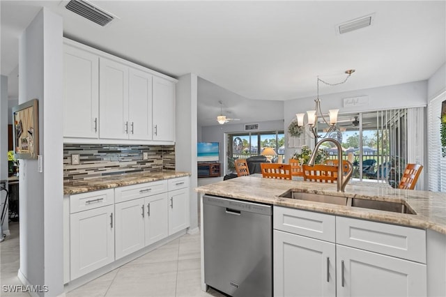 kitchen featuring white cabinetry, sink, light stone countertops, and dishwasher