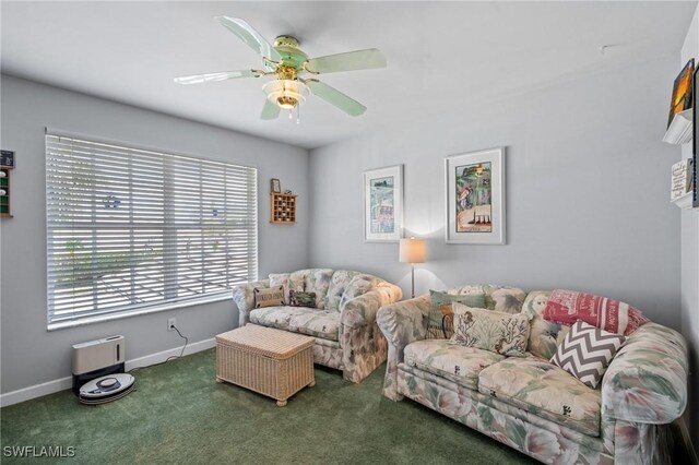 carpeted living room with ceiling fan