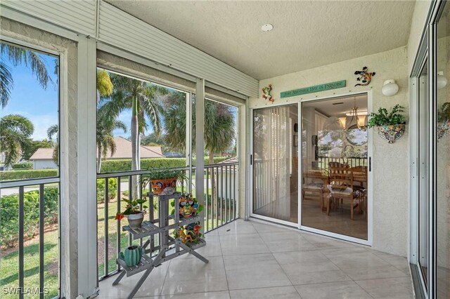 unfurnished sunroom featuring a wealth of natural light