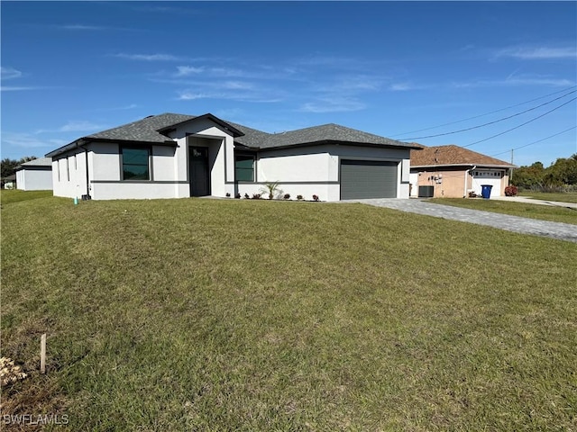 view of front of home featuring a garage and a front yard