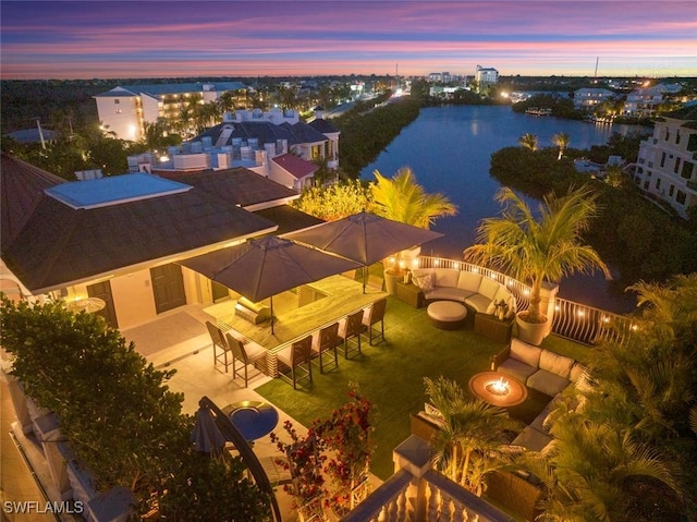 aerial view at dusk with a water view