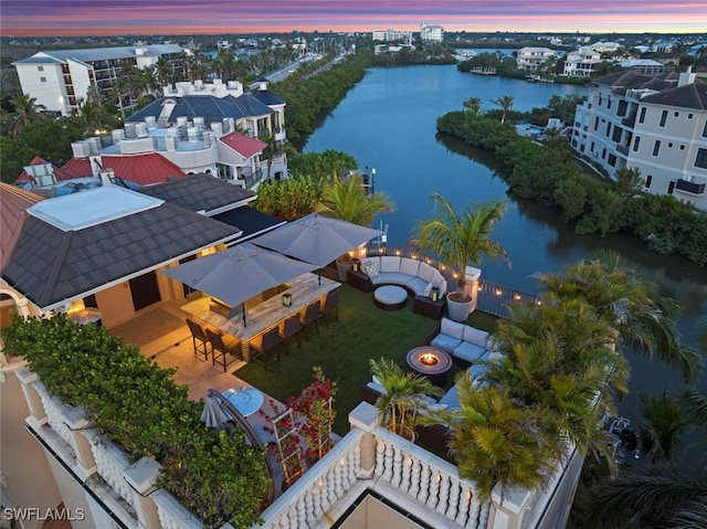 aerial view at dusk with a water view