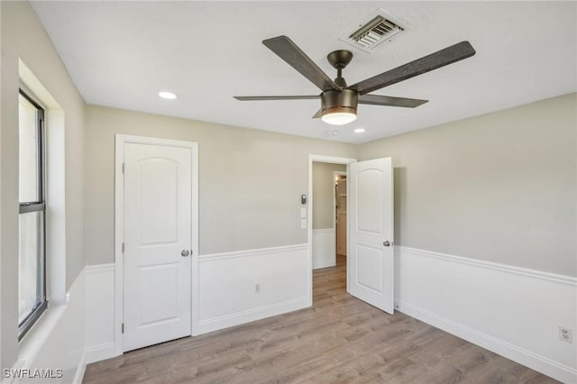 unfurnished bedroom with a closet, ceiling fan, and light hardwood / wood-style floors