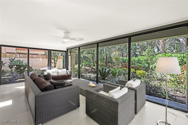 sunroom / solarium with plenty of natural light and ceiling fan