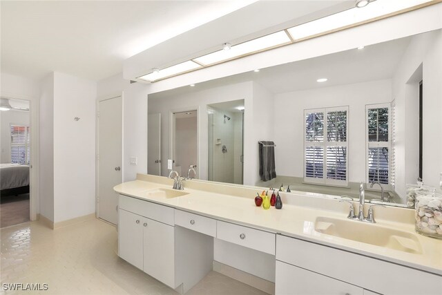 bathroom with vanity, a skylight, and walk in shower