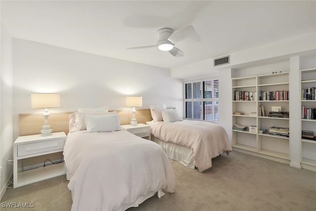 carpeted bedroom featuring visible vents and ceiling fan