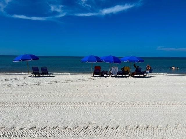 property view of water featuring a beach view