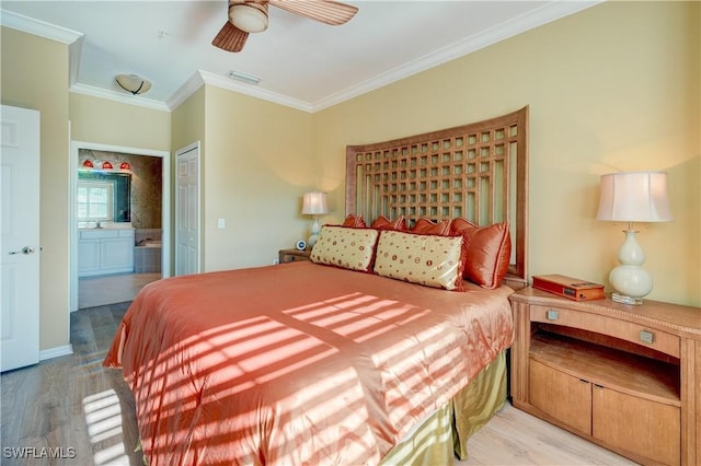 bedroom with crown molding, ensuite bath, a closet, ceiling fan, and light hardwood / wood-style floors