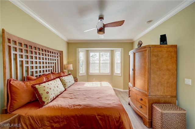 bedroom featuring ceiling fan, ornamental molding, and light hardwood / wood-style floors