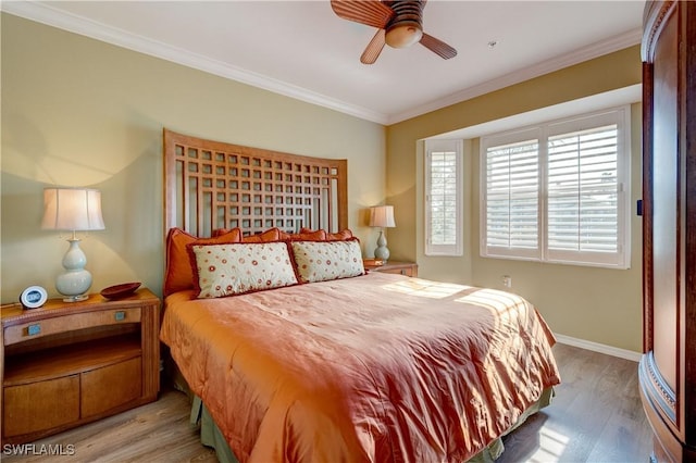 bedroom with crown molding, ceiling fan, and light wood-type flooring