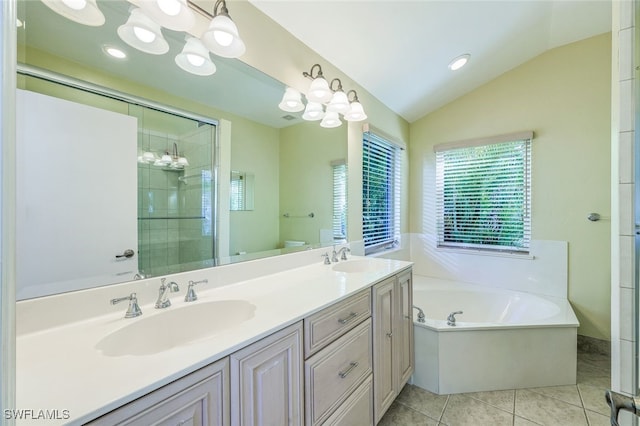 full bathroom featuring vanity, plus walk in shower, vaulted ceiling, tile patterned floors, and toilet