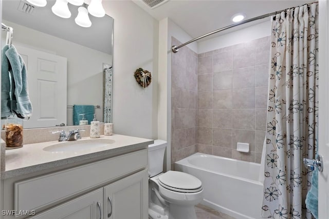 full bathroom with vanity, shower / bath combination with curtain, and toilet