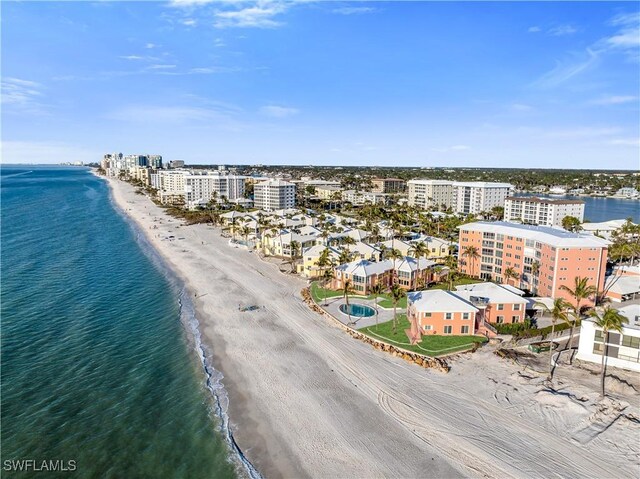 birds eye view of property featuring a view of the beach and a water view