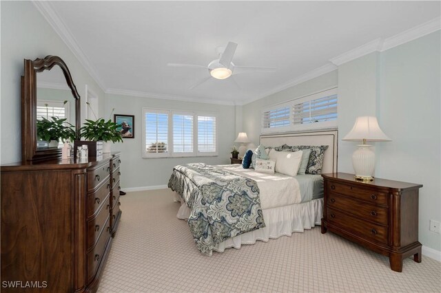 carpeted bedroom featuring ornamental molding and ceiling fan