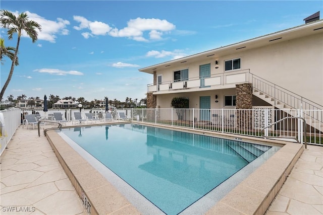 view of swimming pool with a patio area