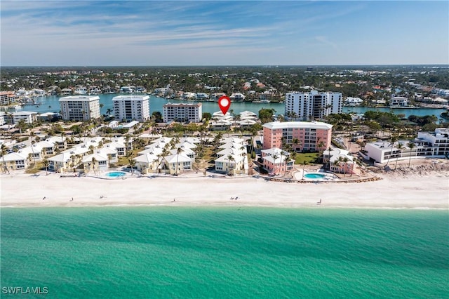 bird's eye view featuring a water view and a view of the beach