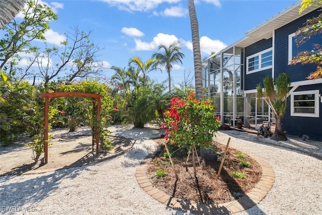 view of yard with a lanai